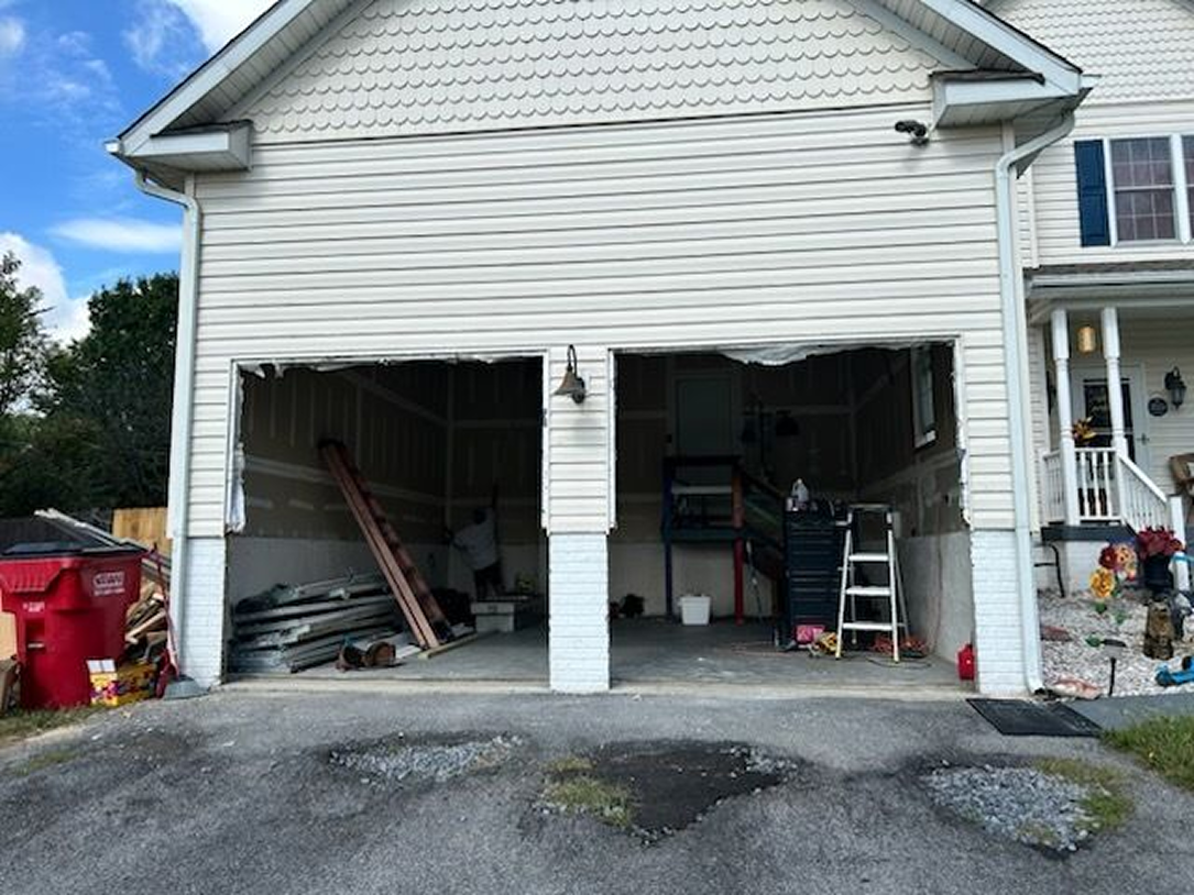 A ladder is sitting in front of a door that is being remodeled.