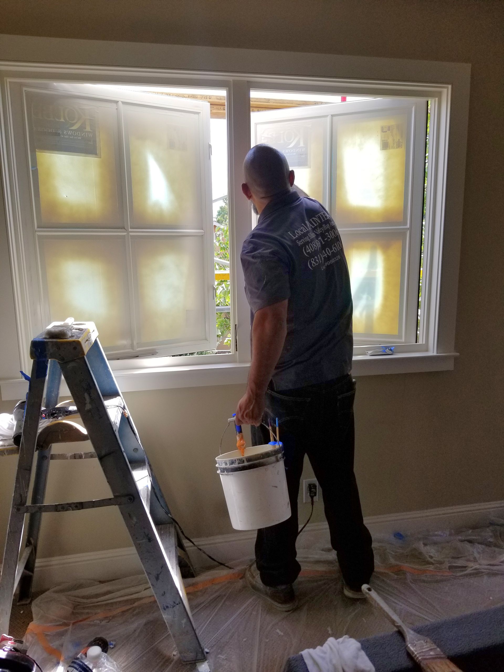 A living room with a couch , chairs , table and fireplace.