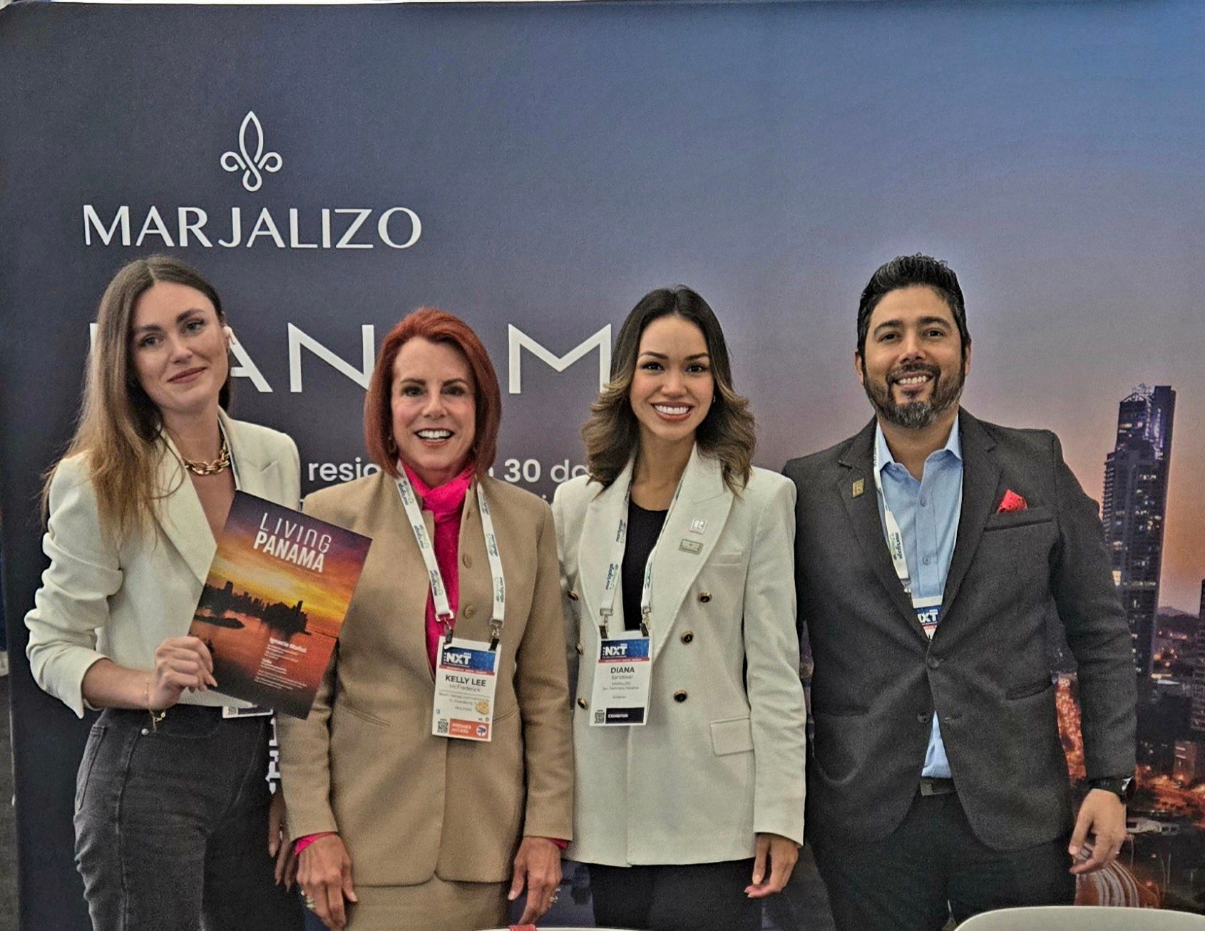 A group of people are posing for a picture in front of a sign that says marjalizo