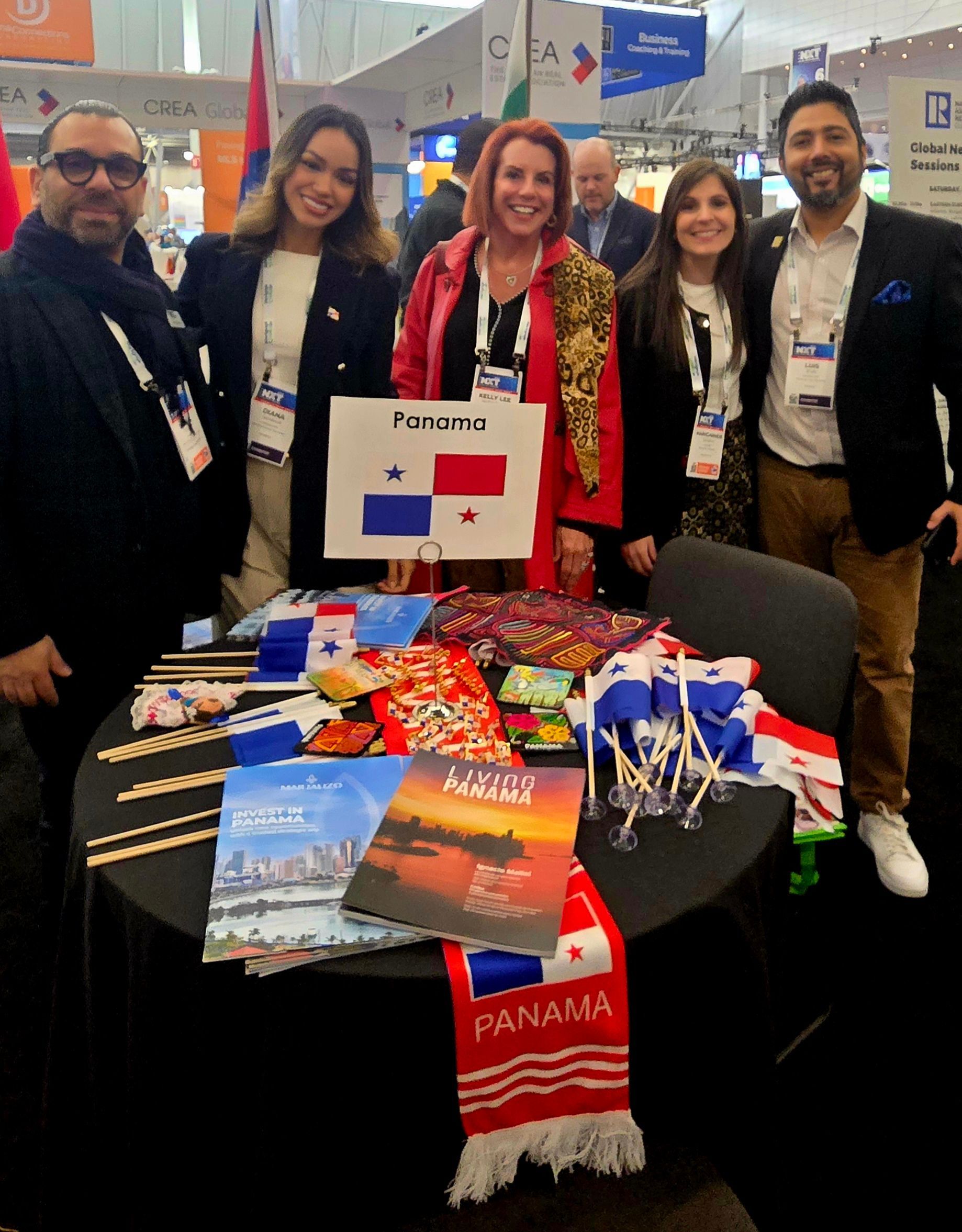 A group of people standing around a table with a sign that says panama