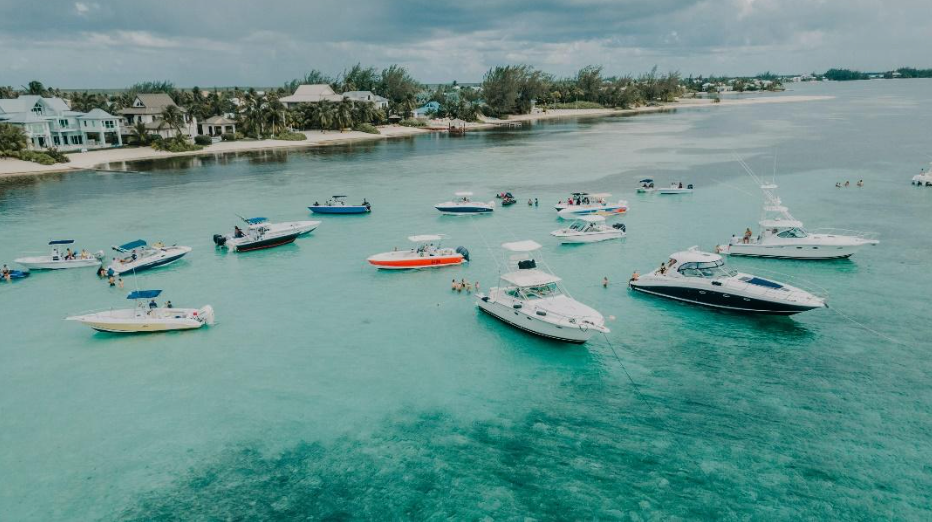 A group of boats are floating on top of a body of water.