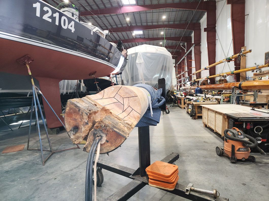 A boat in a warehouse with the number 12104 on the side
