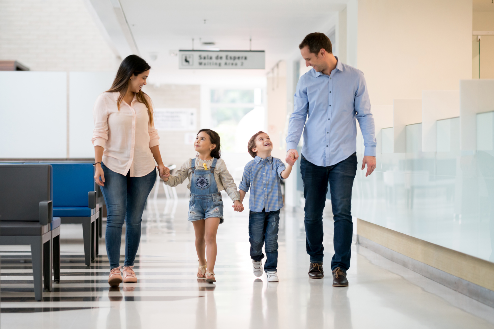 The healthy and happy family visits their doctor at Allmed LA for their annual preventive care visit.