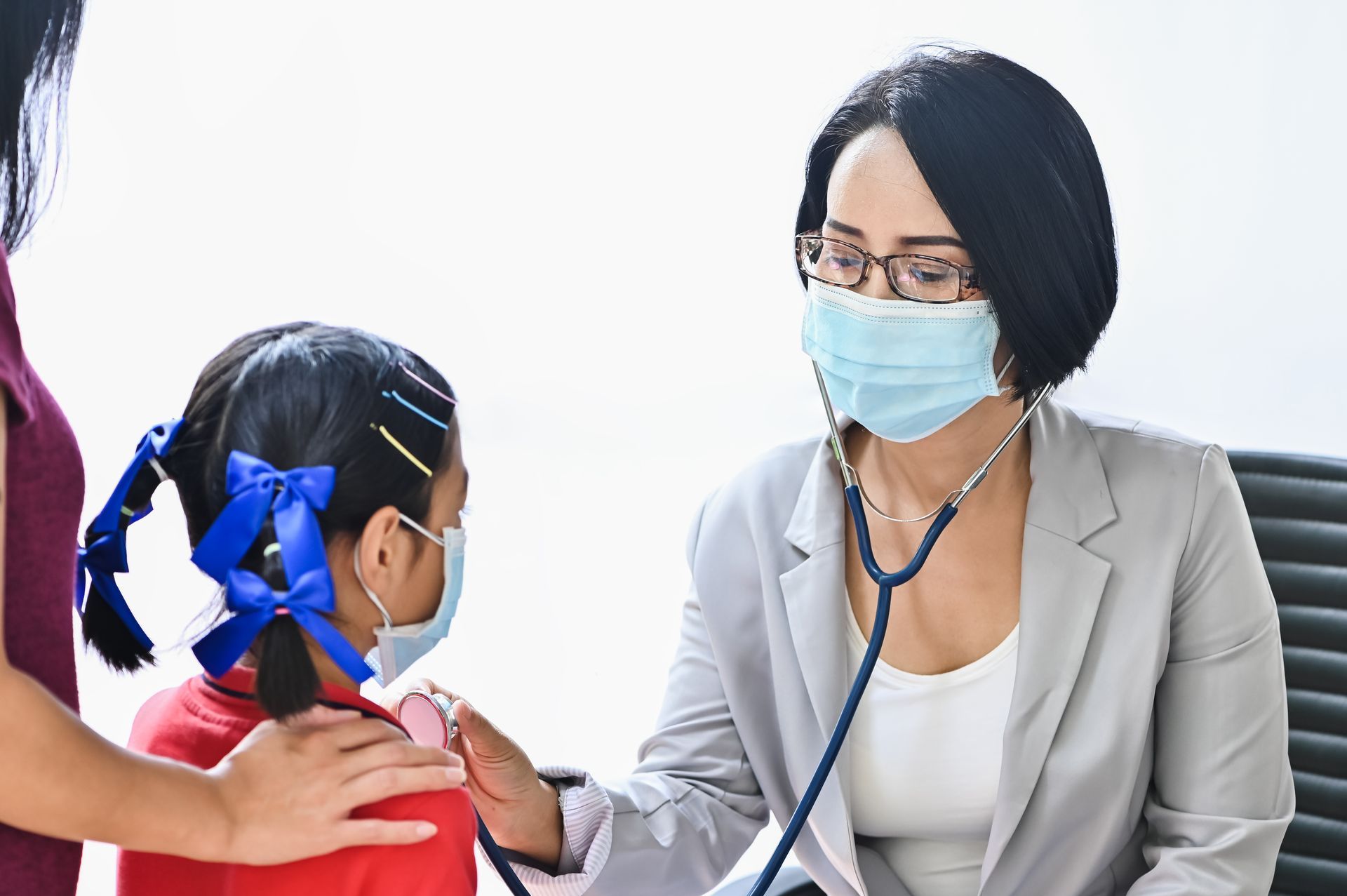 A child with symptoms of RSV getting a check-up from a healthcare provider.