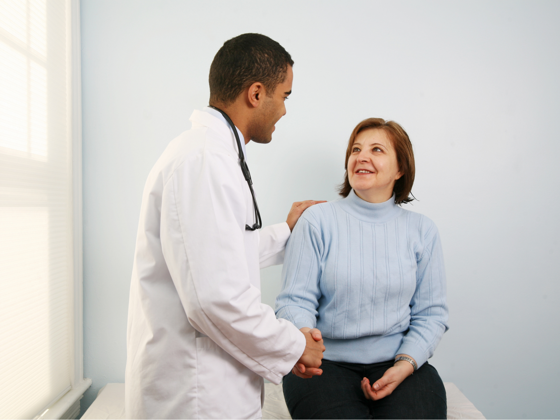 A woman meets her primary care doctor at Allmed LA for her annual checkup.