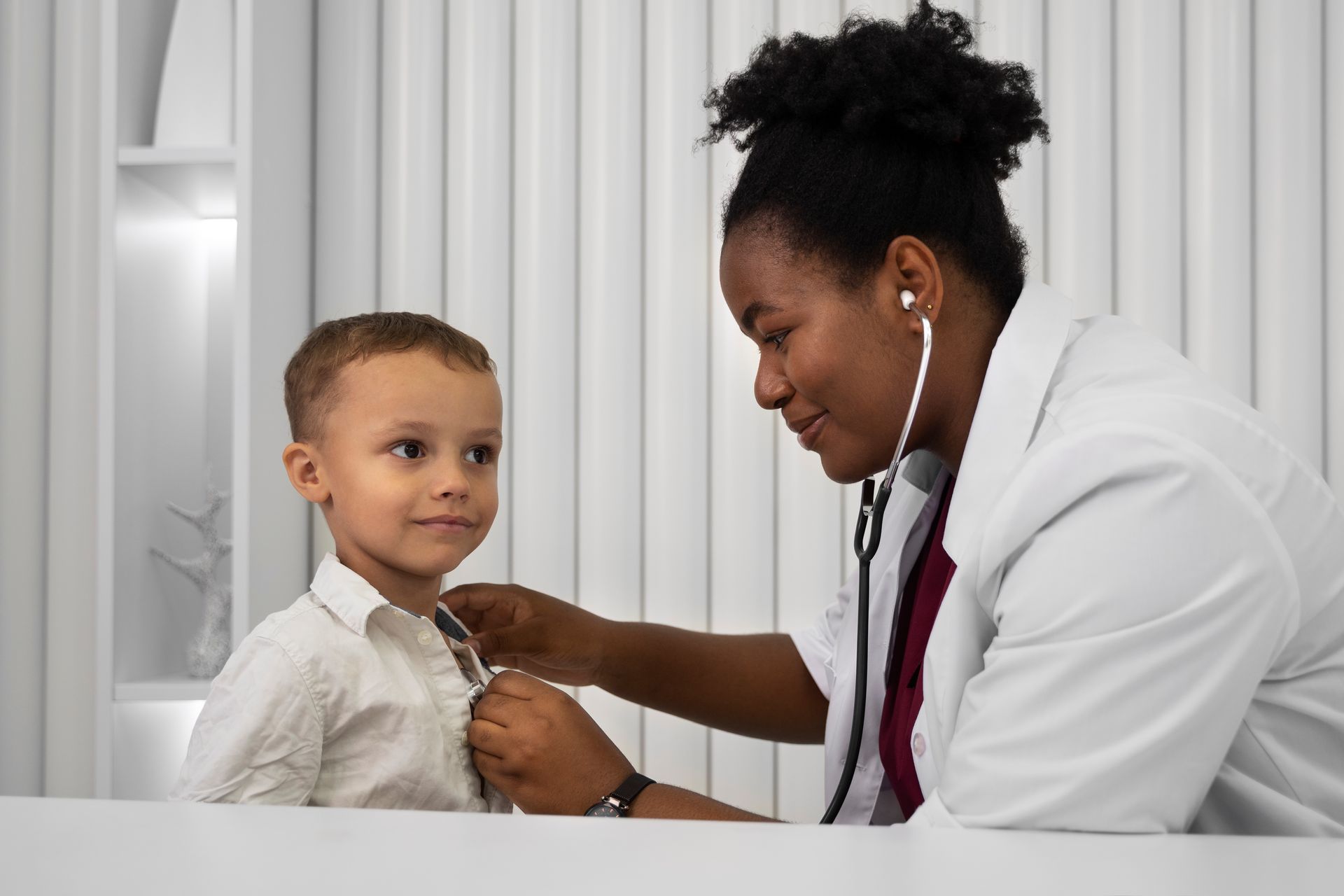 pediatrics doctor and child patient high five