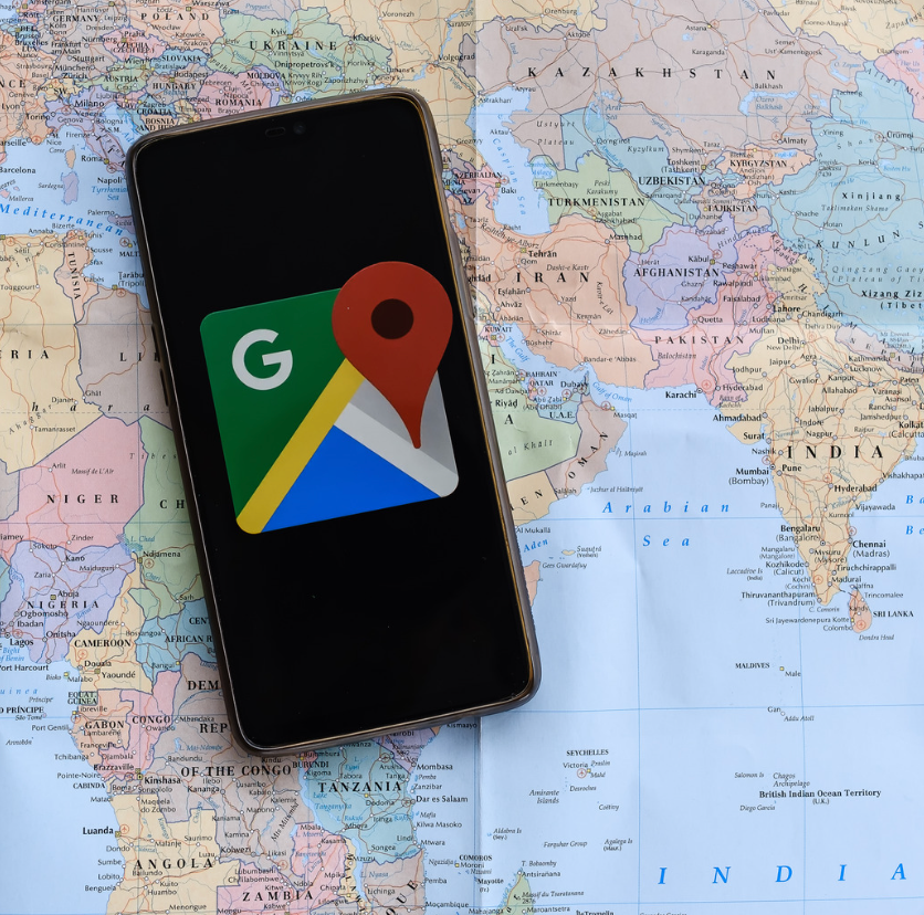 A cell phone with google maps on the screen