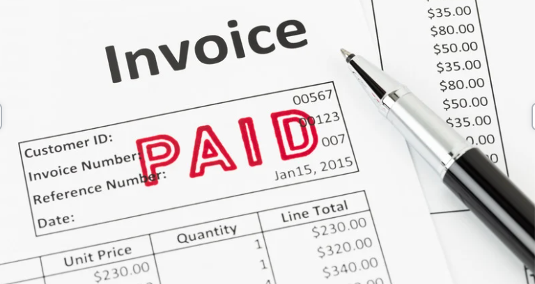 An invoice with the word paid written on it