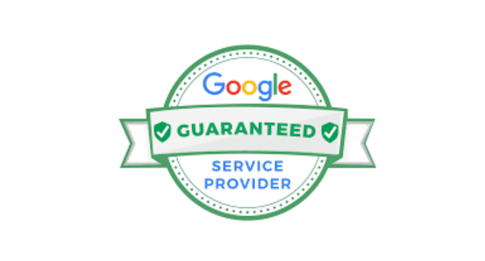 A bathroom with blue tiles and a sliding glass shower door.