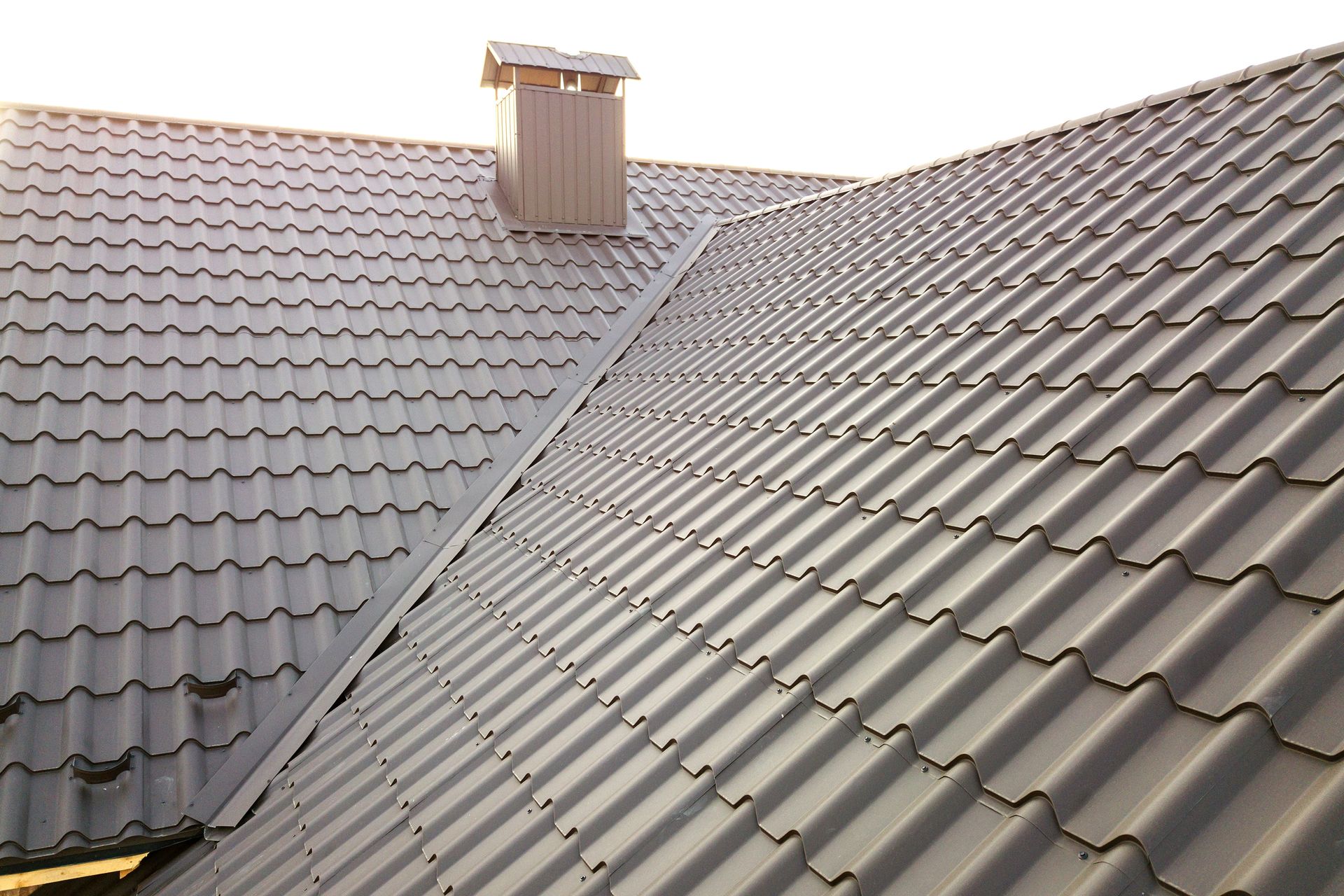 A roof with a chimney on top of it