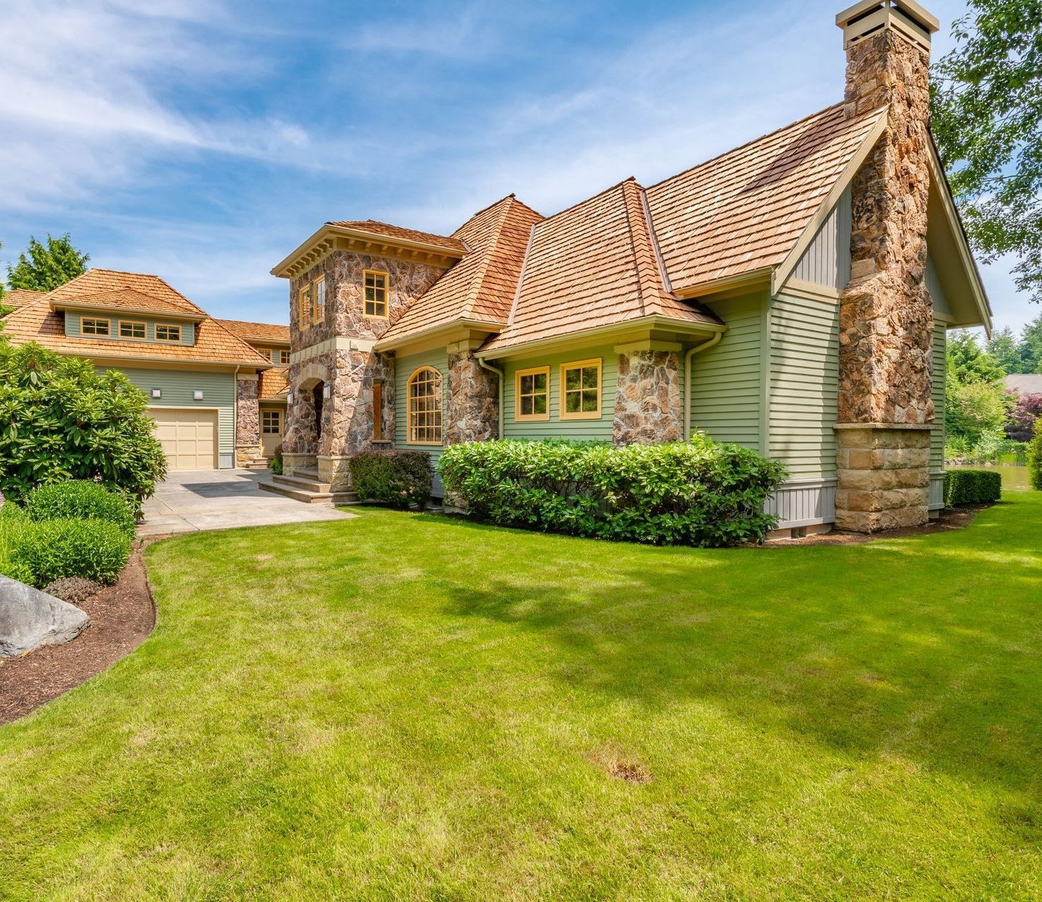 A large house with a large lawn in front of it