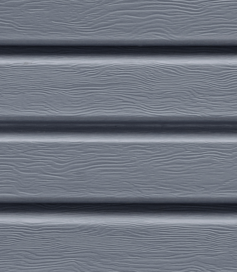 A close up of a gray siding on a house.