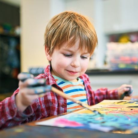 Boy Enjoys Painting — Cheyenne, WY — The Backyard Child Care Center
