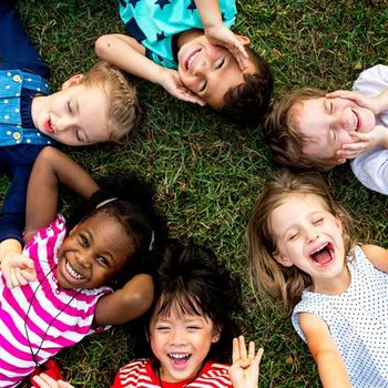 Kids Having Fun on Grass — Cheyenne, WY — The Backyard Child Care Center