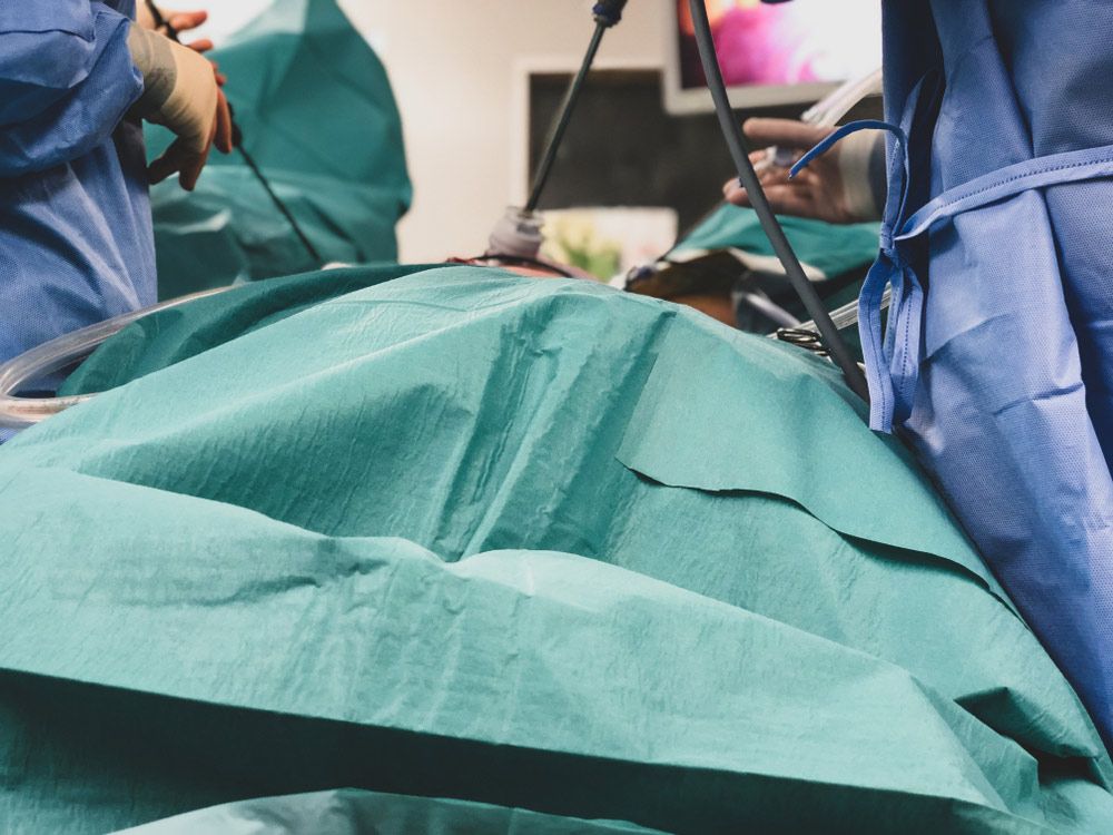 A Group of Surgeons are Performing Surgery on a Patient in an Operating Room — Brisbane Upper GI Surgery in Chermside, QLD