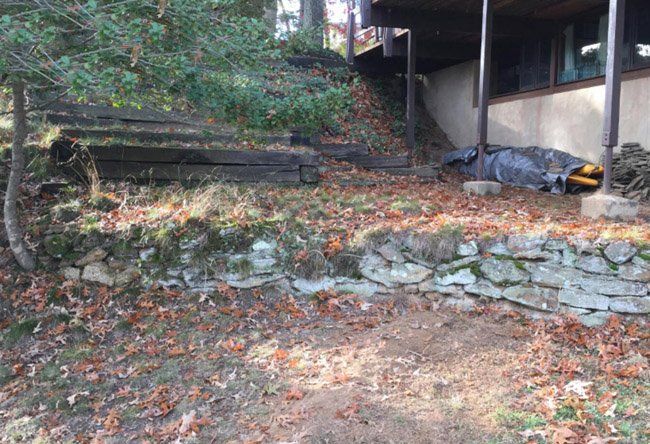 A stone wall in need of repair.