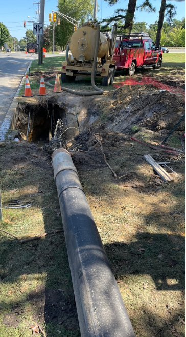 Installing a sanitary force main at an apartment complex.