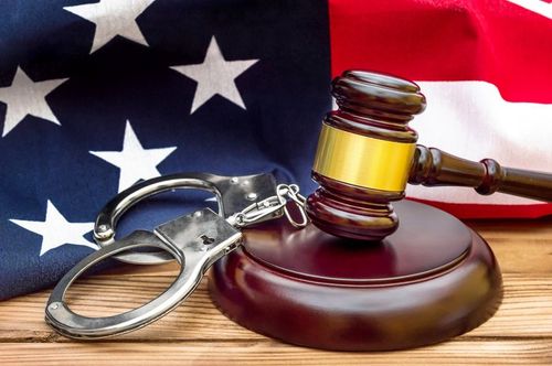 Criminal Cases — Gavel, Handcuffs and American Flag in Akron, OH