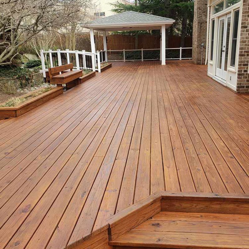 A close-up view of a house undergoing vinyl siding installation.