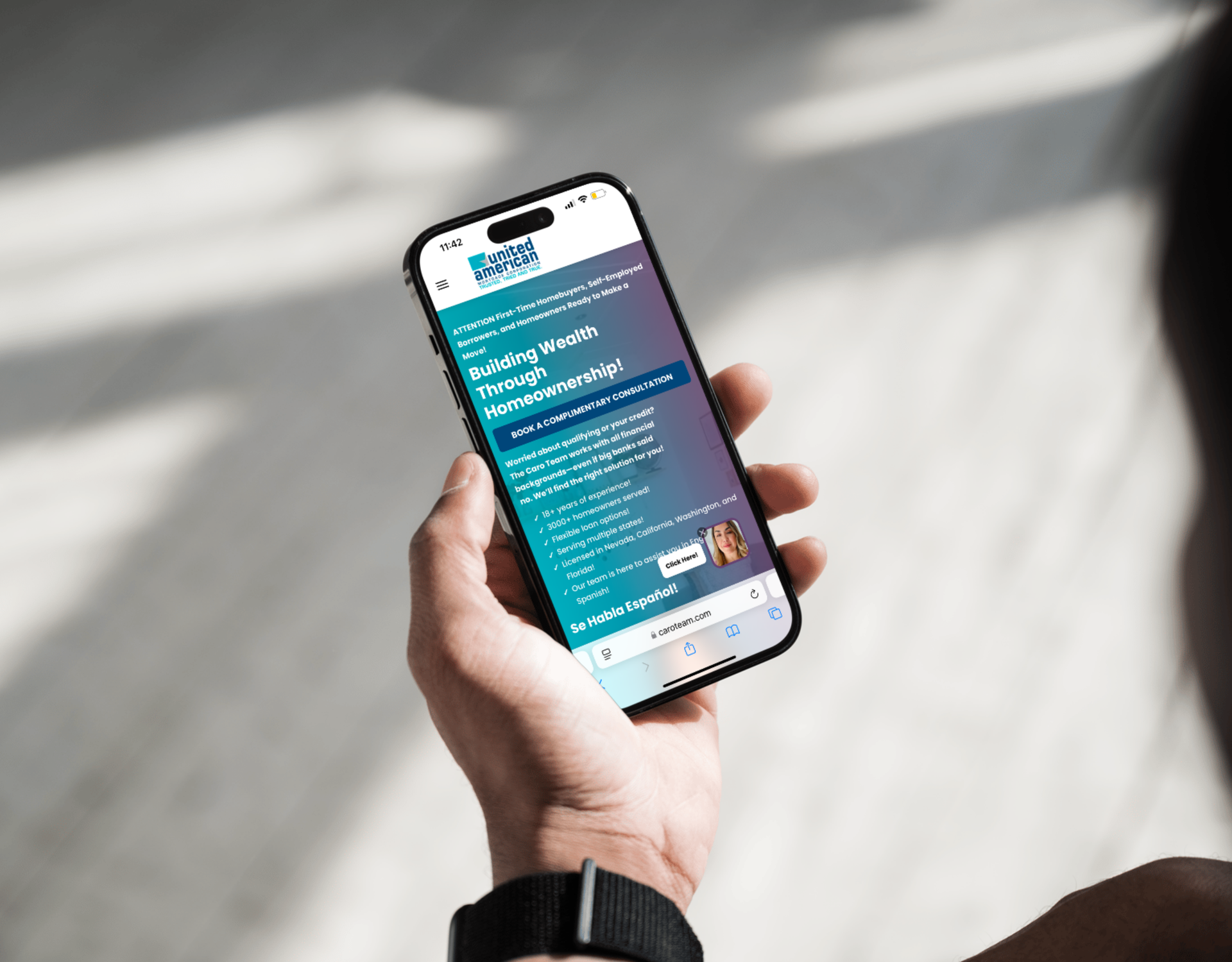 A person is holding a cell phone in their hand.