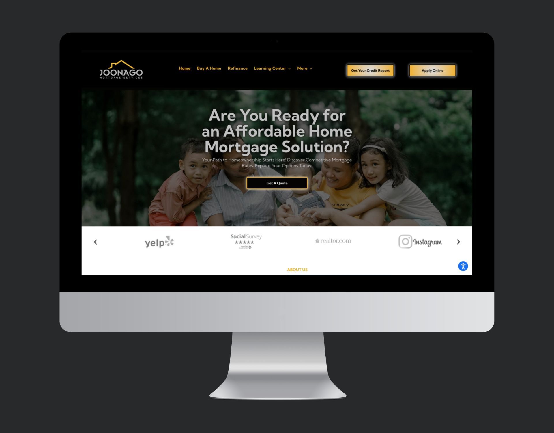 A computer monitor is displaying a website for an affordable home mortgage solution.