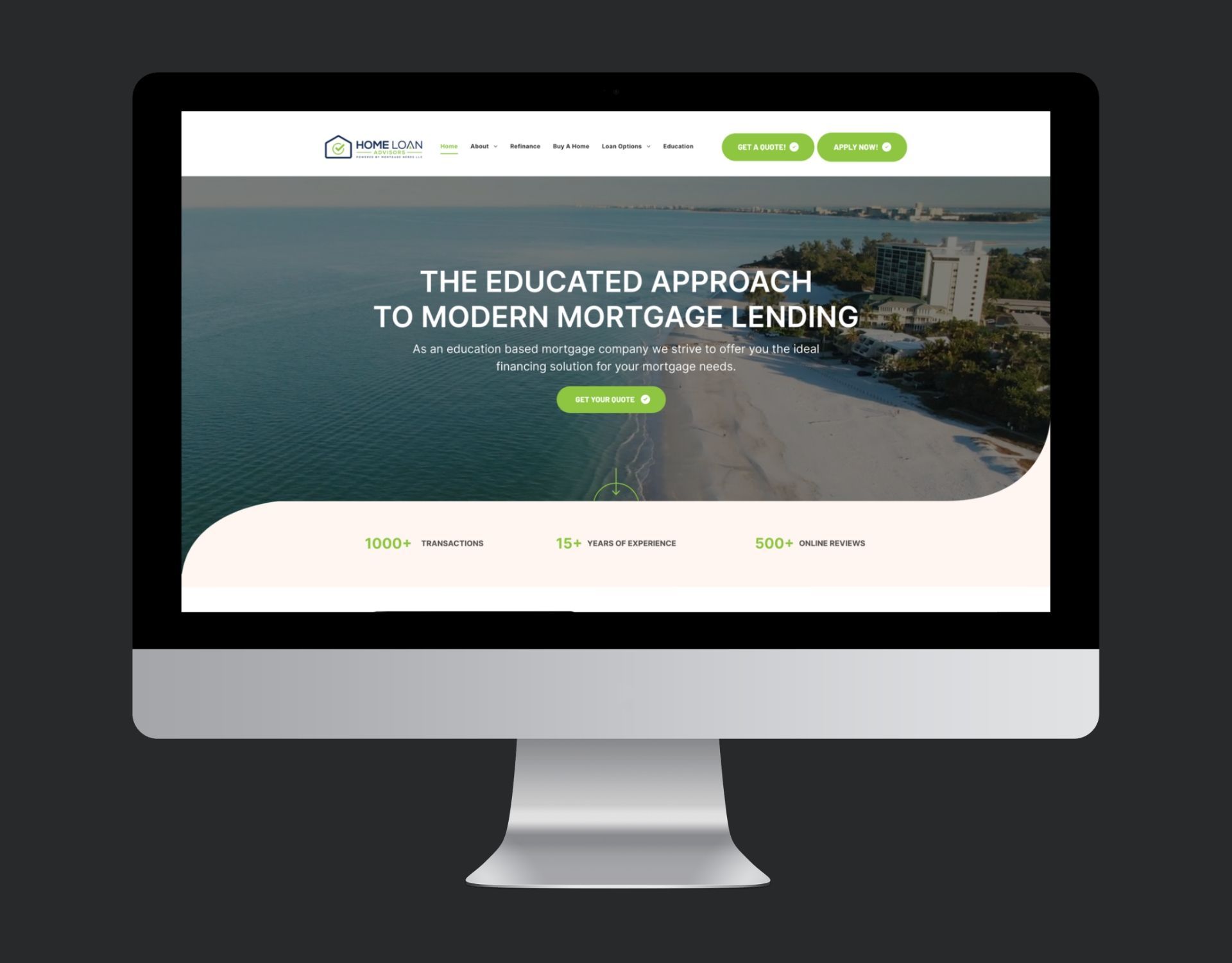 A computer monitor is displaying a website for the educated approach to modern mortgage lending.