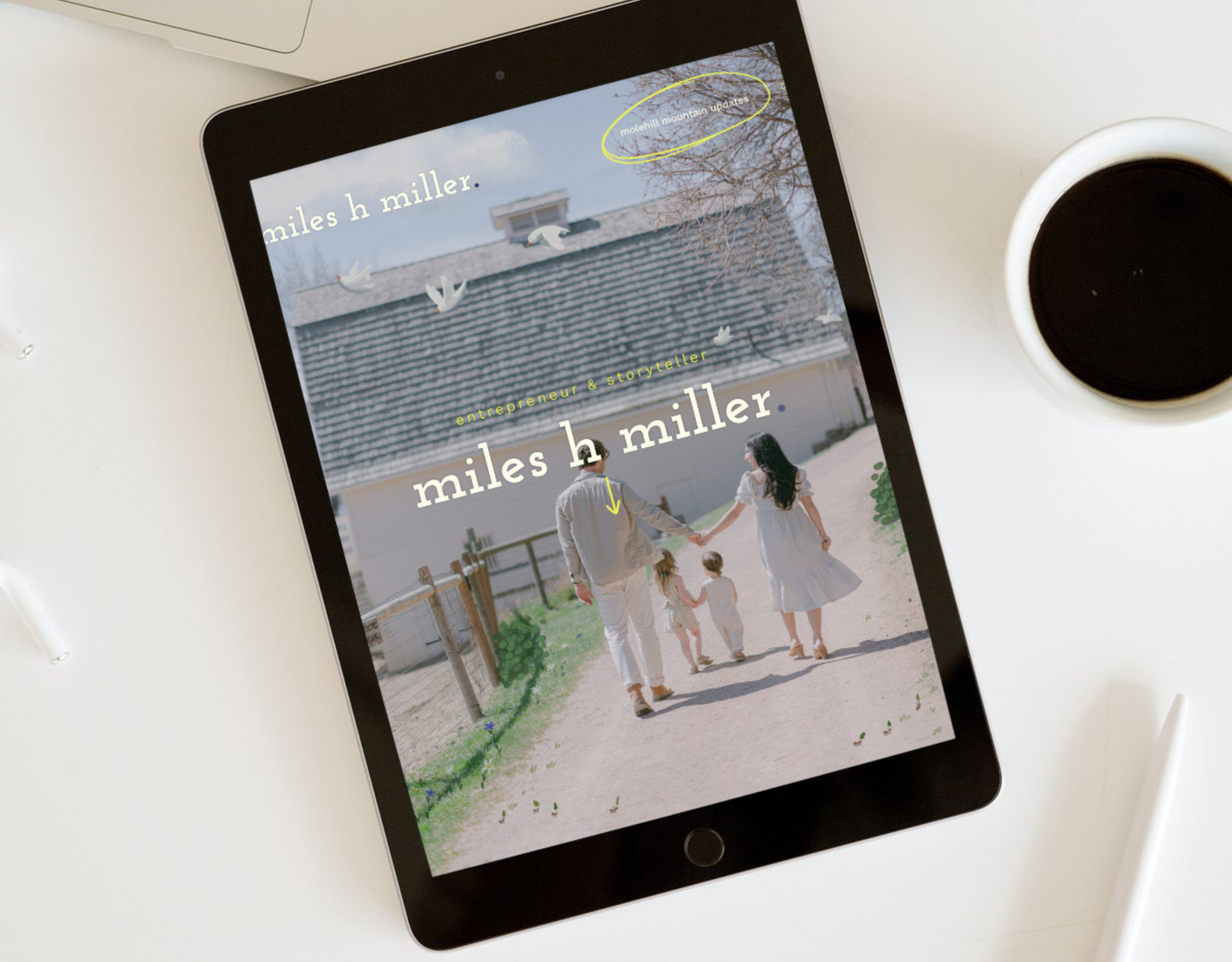 A tablet is sitting on a table next to a cup of coffee.