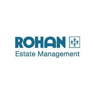 The logo for rohan estate management is blue and white.