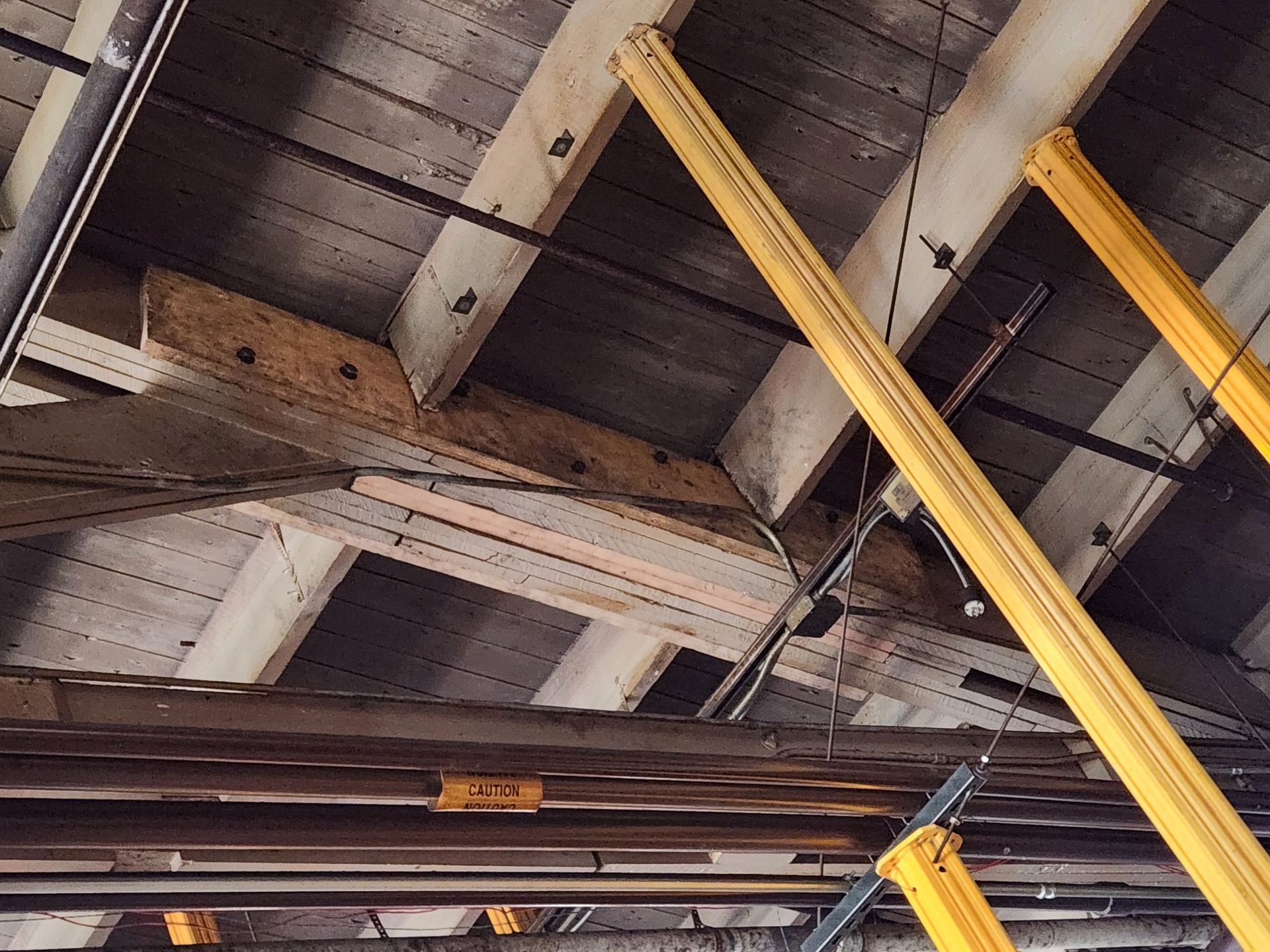 A large building under construction is covered in snow