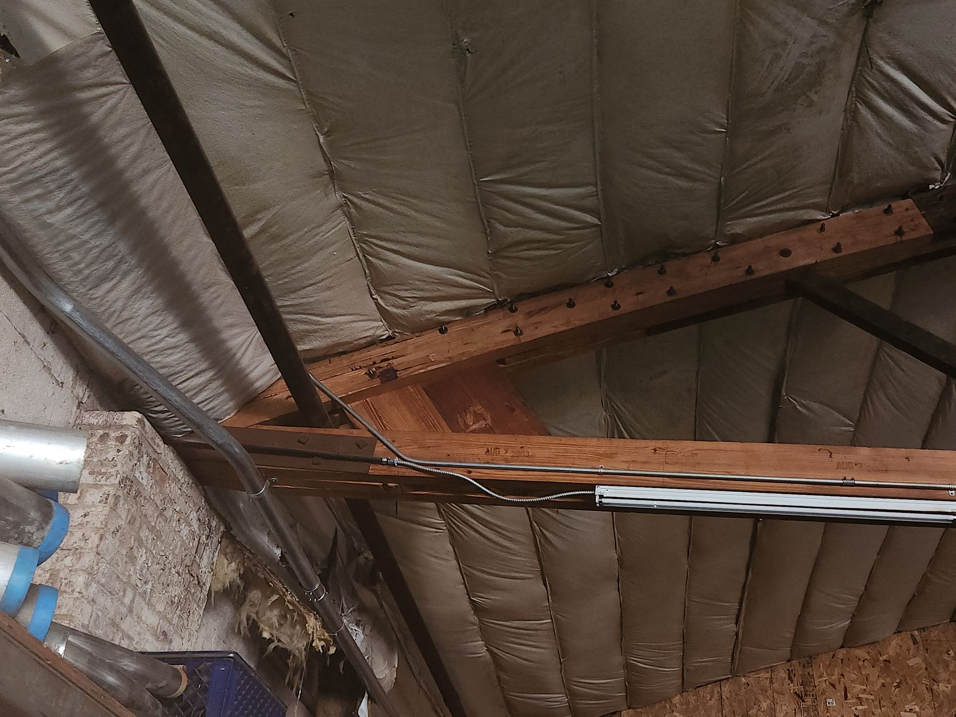 Mass timber truss repair on insulated industrial roof in Oshkosh and Milwaukee DMAs
