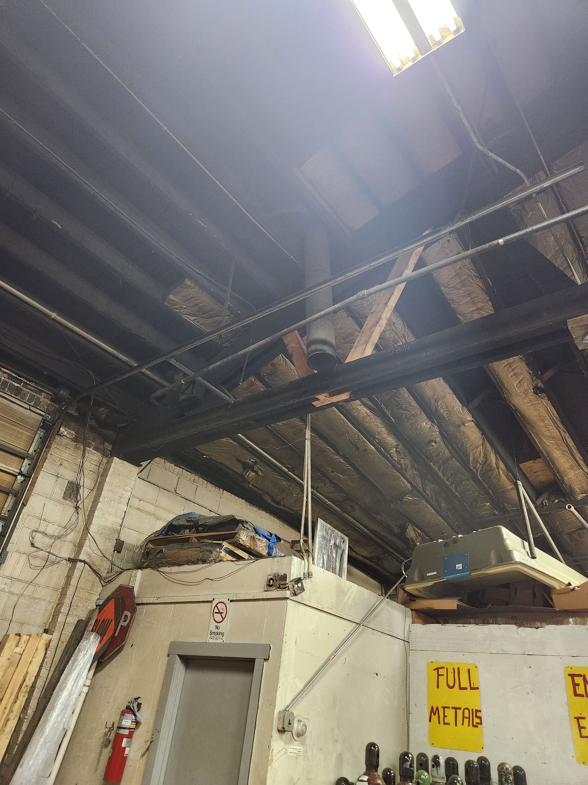 Close-up view of wooden roof framing components during building inspection in Sugar Land, Texas.
