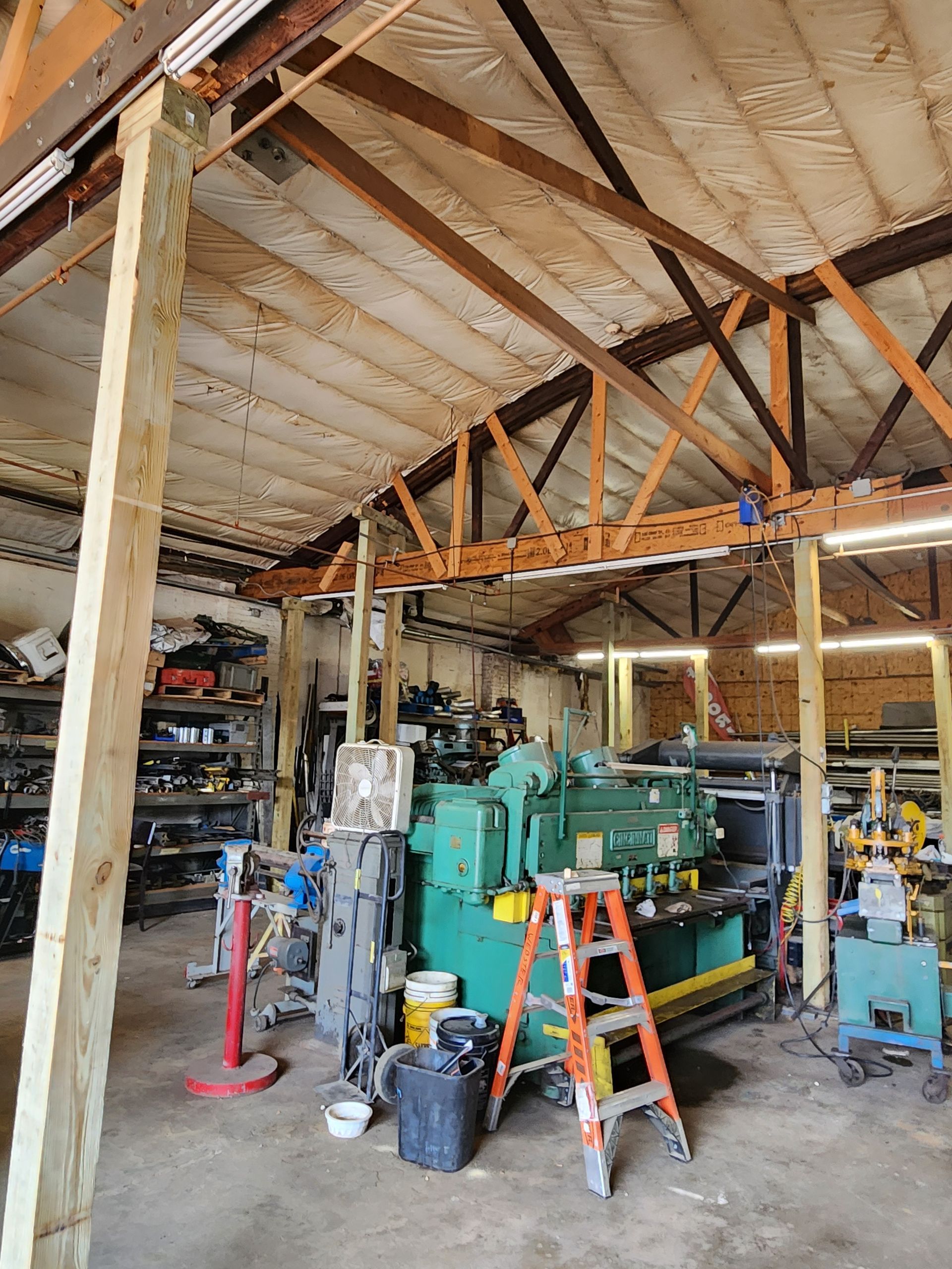 Structural inspection of a wooden roof truss system in a residential building in Sugar Land, Texas.
