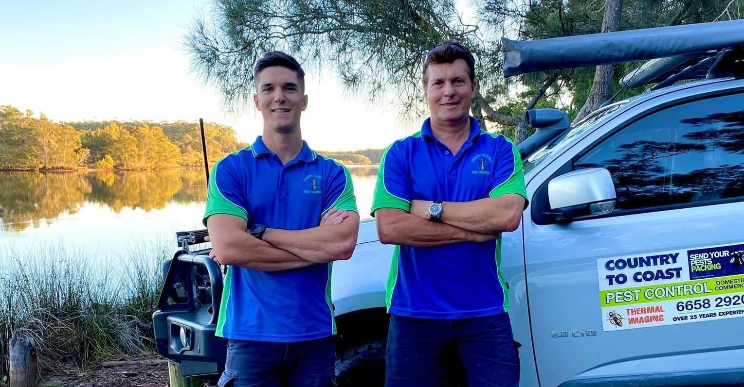 A Man Wearing a Mask is Holding a Rope — Country to Coast Pest Control In Sawtell, NSW