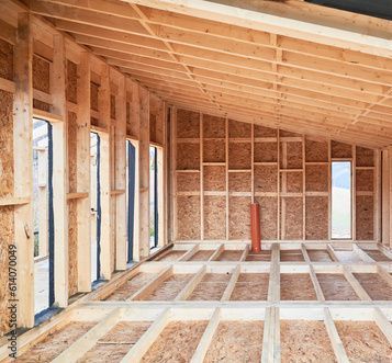 The inside of a wooden house under construction.
