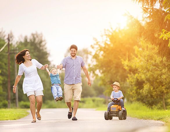 family smiling together knowing they have life insurance