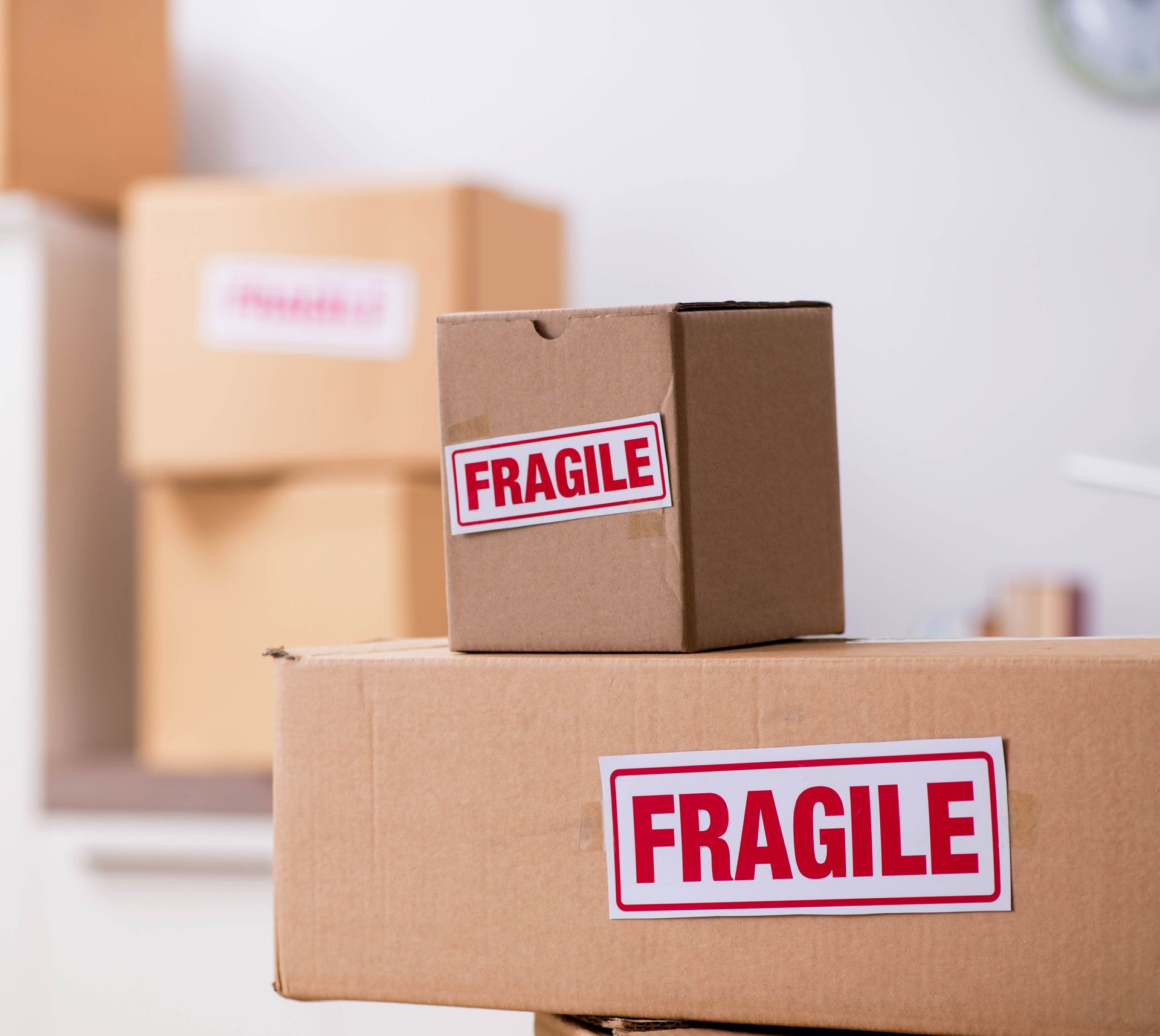 A Cardboard Box With a Fragile Sticker on It — FNQ Furniture Removals in Port Douglas, QLD