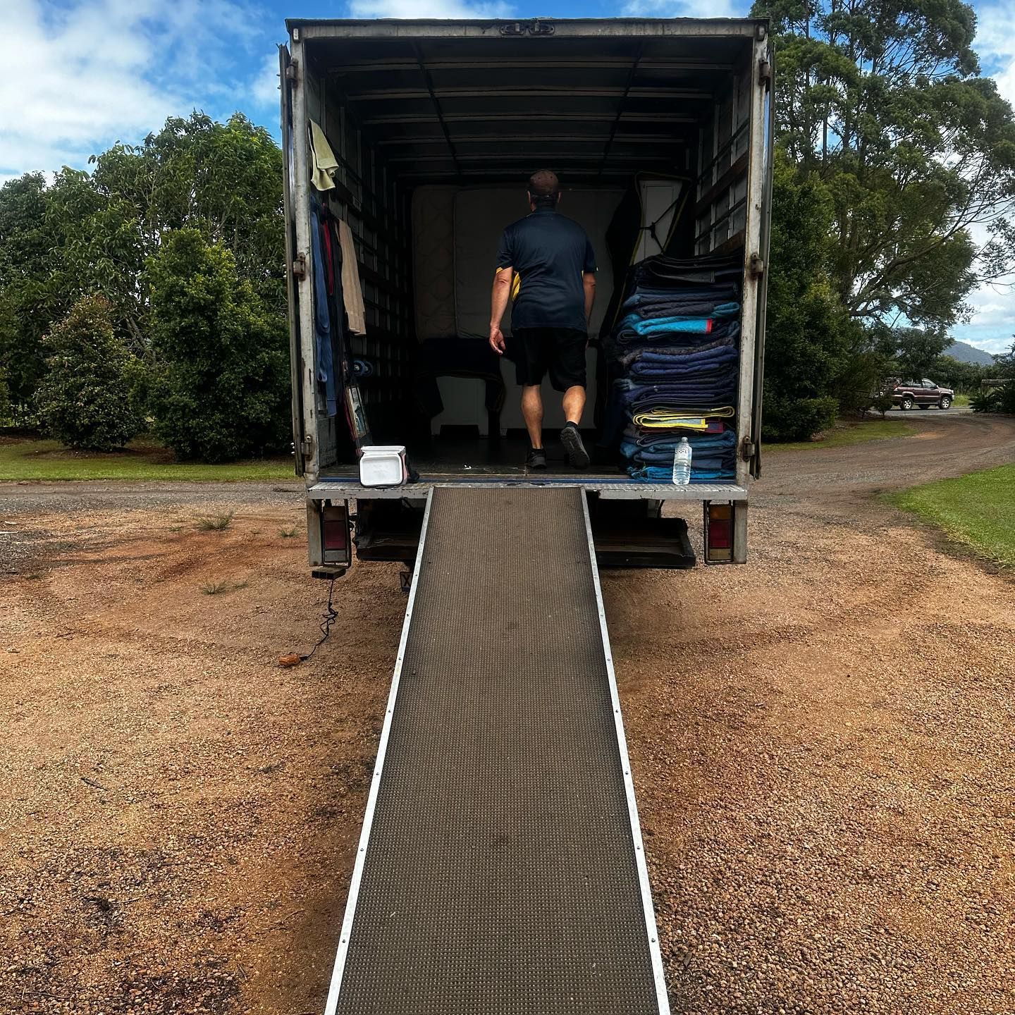 The Inside of a Moving Truck Filled With Boxes and Blankets — FNQ Furniture Removals in Stratford, QLD