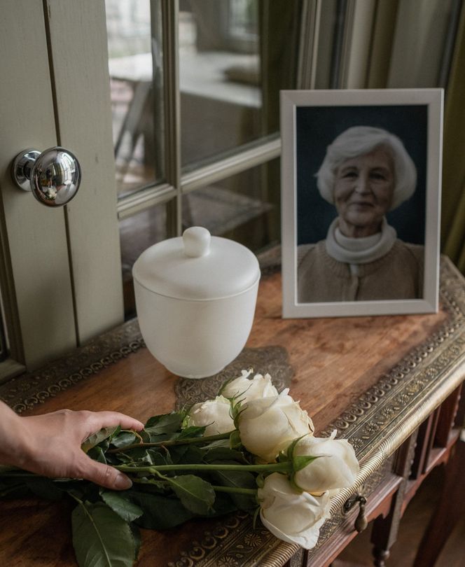 Urn Memorial With Hand Holding flowers