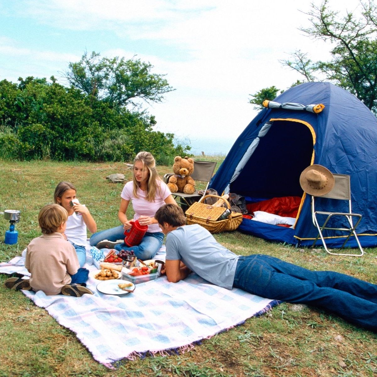 family having picnic by tent