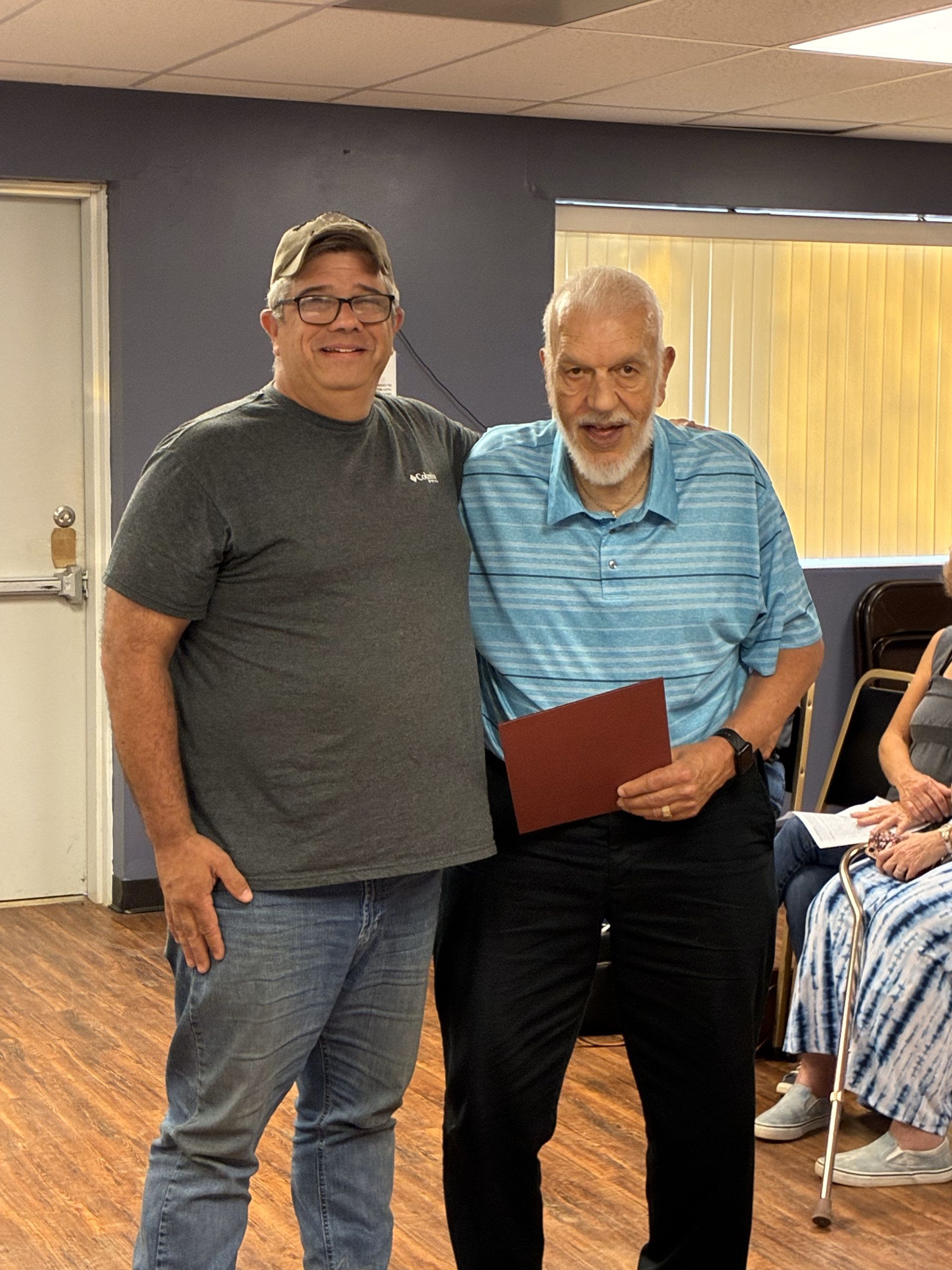 Mayor Paul Eckeberger and newly appointed councilmember Rick Robertson stand together, after Mayor Eckeberger issued Certificate of Appointment to Rick Robertson at the June 19th, 2025 Regular Council Meeting.