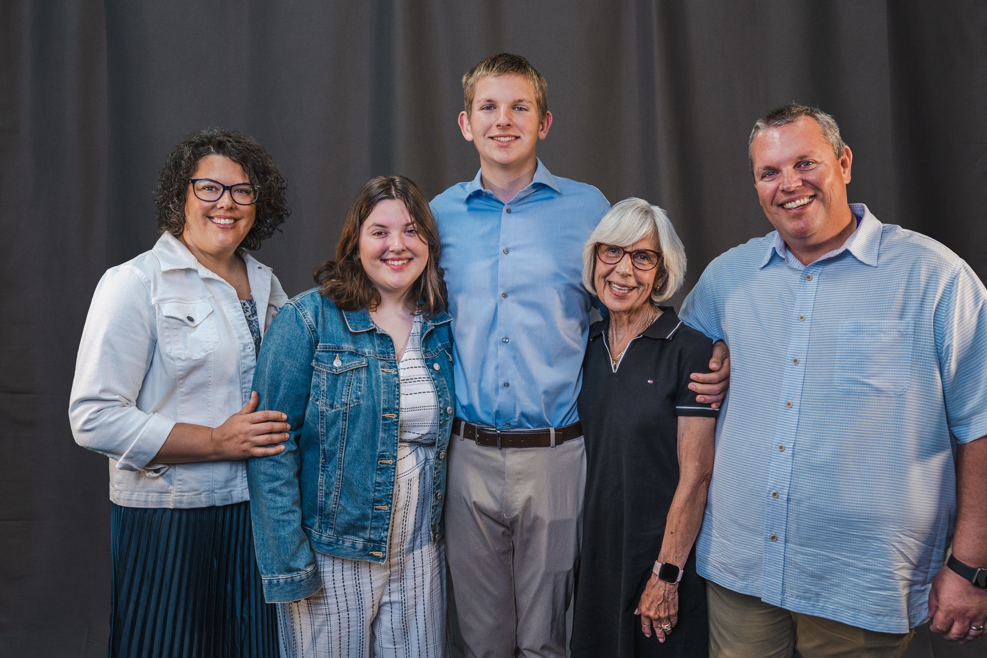 A group of people are posing for a picture together.