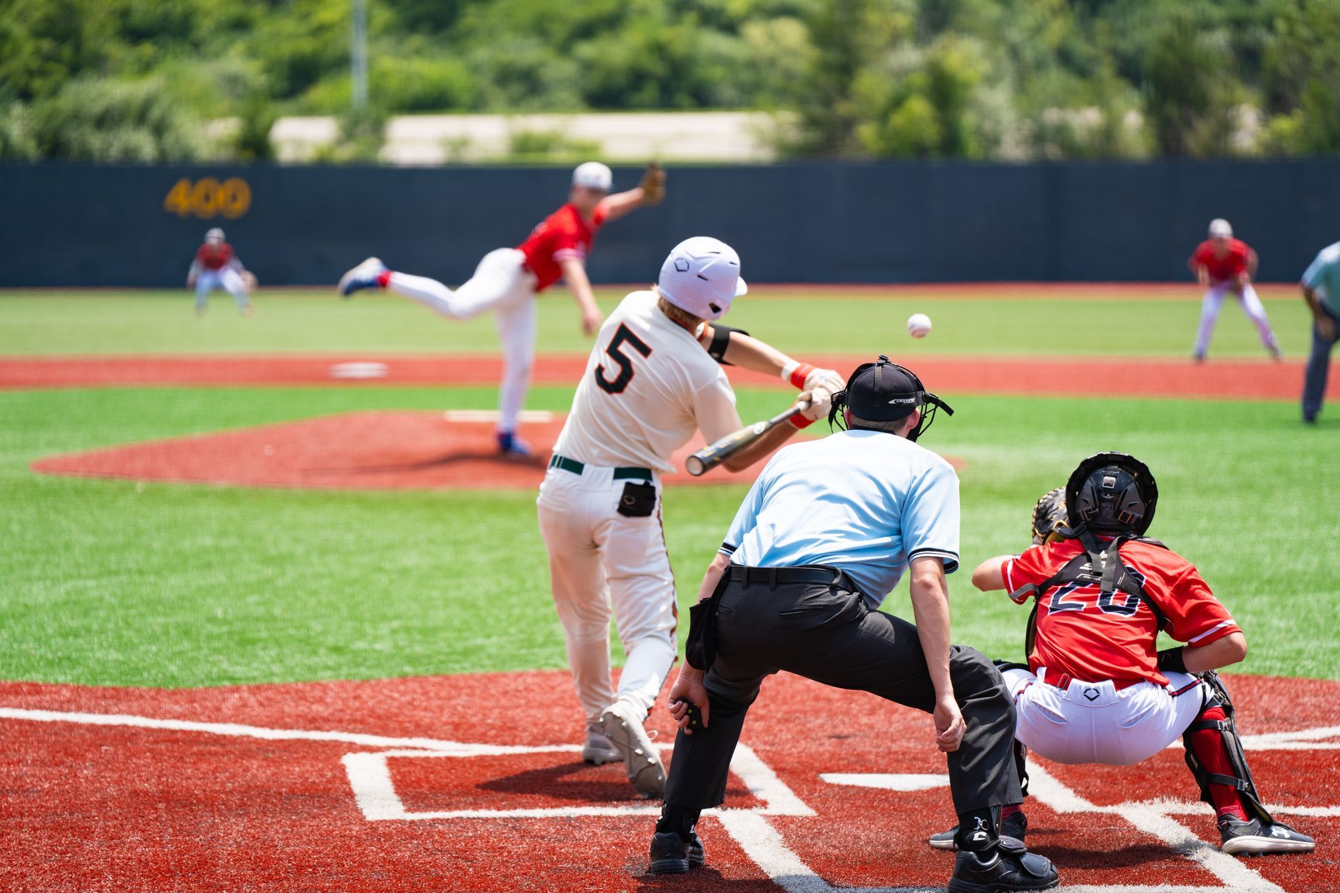 A baseball game is being played on a baseball field.