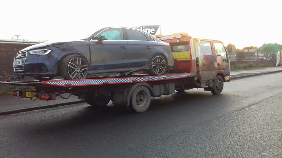 car on a tow vehicle