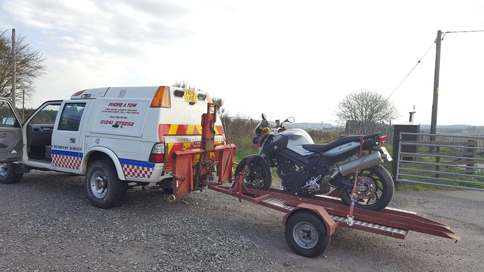 bike being pulled by a tow vehicle