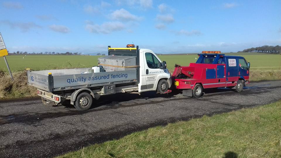 recovery vehicle pulling a truck