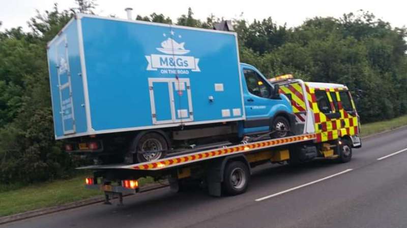 automobile on a flat bed truck