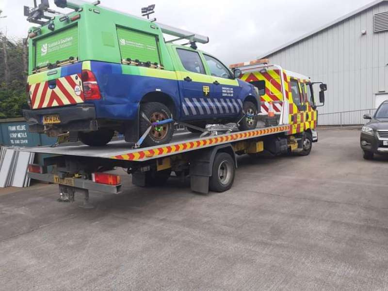 automobile on a recovery truck