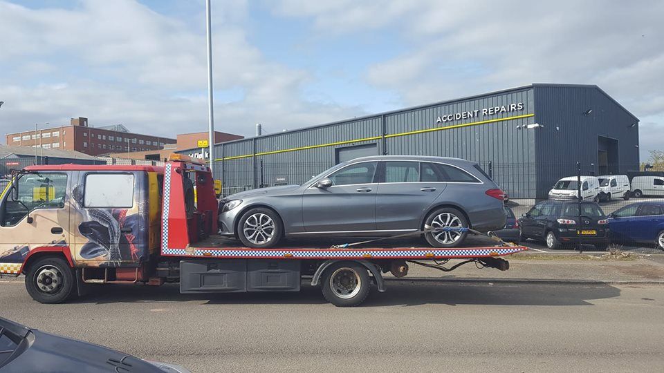 car loaded on a recovery truck