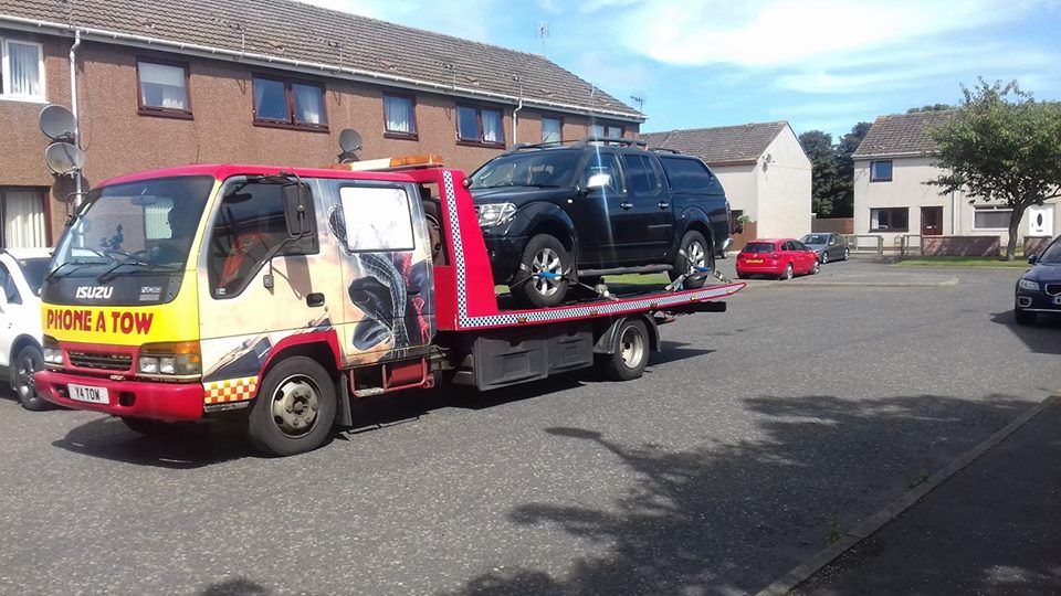 car loaded on a recovery vehicle