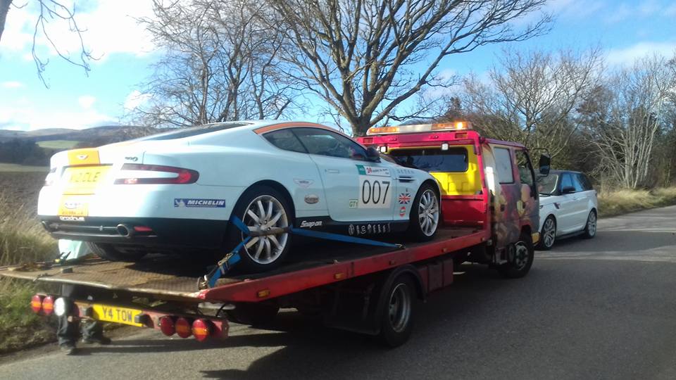 view of a car on a recovery vehicle